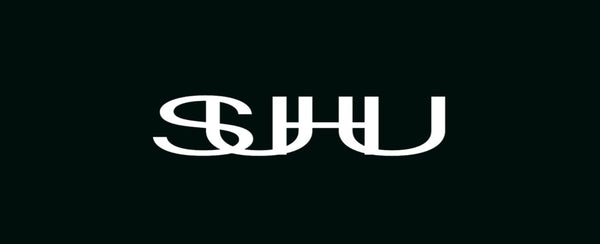 White SUHU Logo on a black background