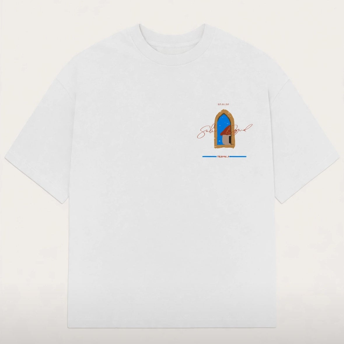 A white SUHU Original short-sleeve crewneck t-shirt with a small graphic print on the left chest depicting a blue and brown arched doorway with the word  written in cursive.